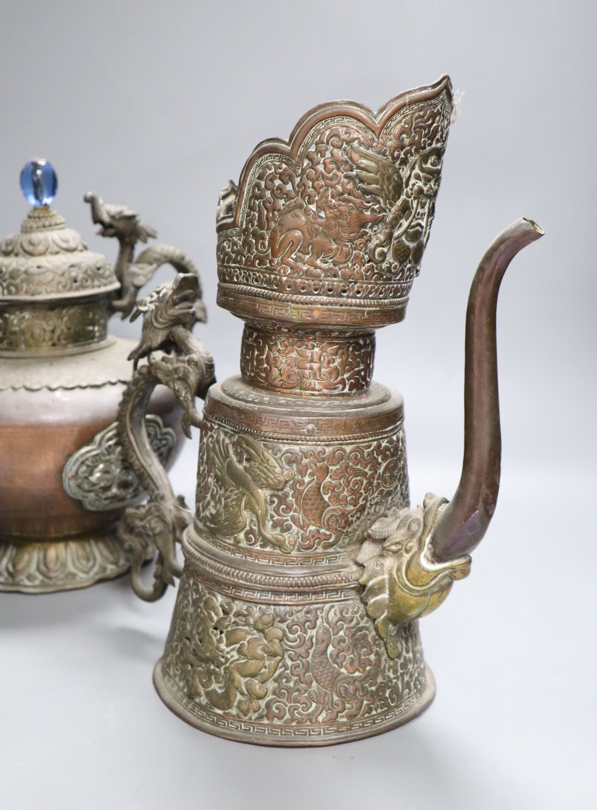 A 19th century Tibetan duomuhu ewer and a teapot, tallest 31cm